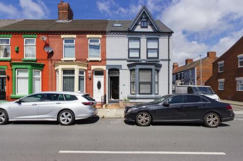 A charming row of terraced houses with colorful...