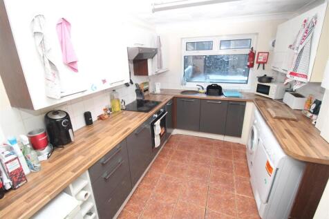 Bright, well-equipped kitchen with ample storag...