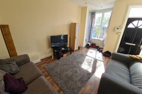 A bright and welcoming living room featuring co...