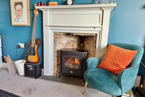 Bedroom 5 fireplace with electric stove