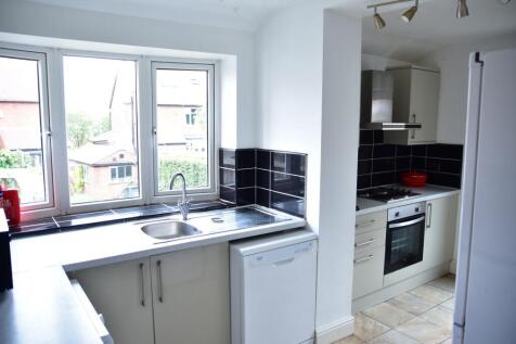Bright and airy kitchen with large windows and ...
