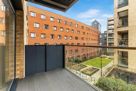 Relax and unwind on your private balcony with a captivating courtyard view.