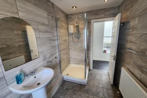 Bright and clean bathroom with modern fixtures,...