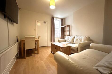 Bright lounge with comfy sofas and dining area...