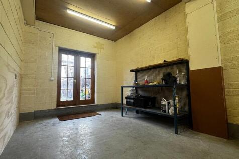 Spacious storage room with shelving...