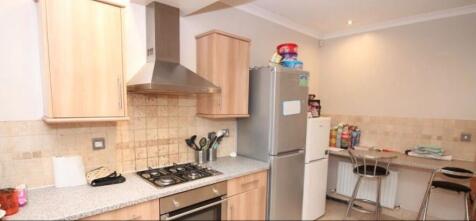 Well-equipped kitchen with modern appliances, s...