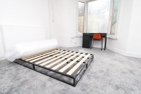 Bright master bedroom with large bay window...