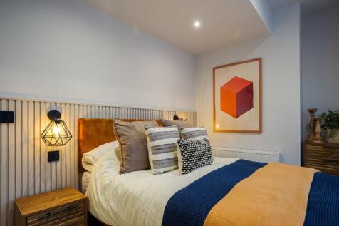 Cosy stylish bedroom with bold artwork...