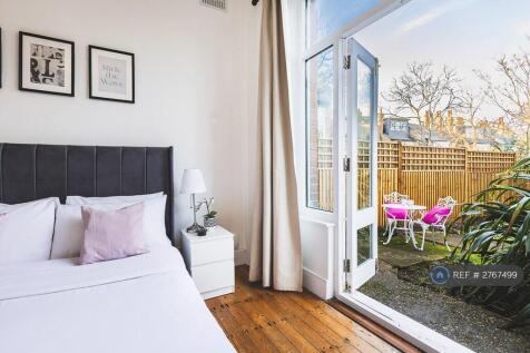 Bedroom With Doors Opening Into Private Garden
