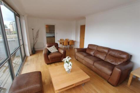 Bright, open living space with leather seating...