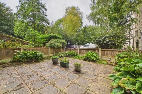 Spacious flagged, west facing garden