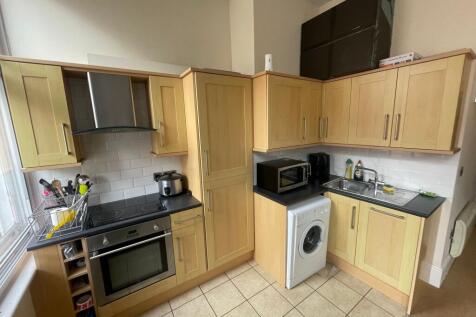 Modern fitted kitchen with abundant storage...