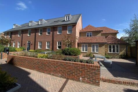 Well-kept brick-front property with neat courty...
