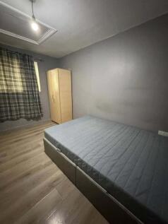Modern double bedroom with sleek wood flooring...