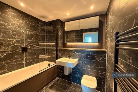 Family Bathroom With Bath Tub
