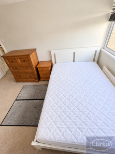 Bright Minimalist Bedroom with Pine Furniture