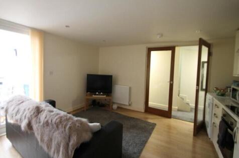 Bright and inviting living room featuring a com...