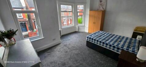 Spacious bright bedroom with large bay windows...