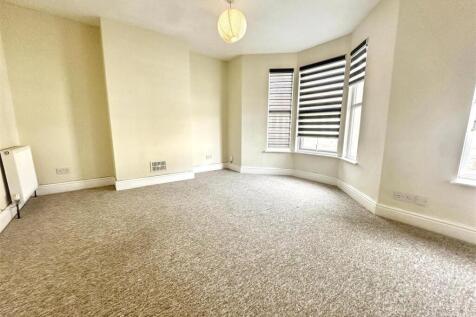 Bright bedroom with bay window and space...