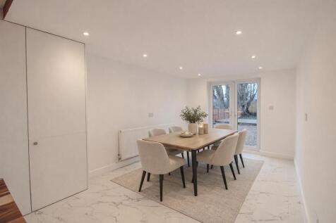 Modern dining with green accents.jpg