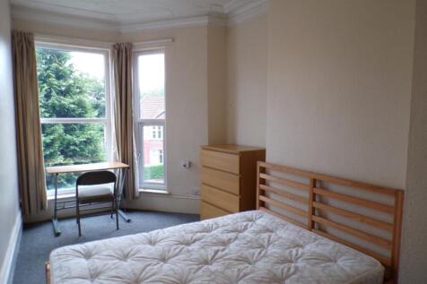 Bright and spacious double bedroom featuring la...