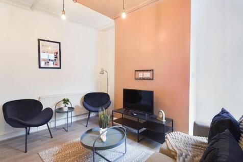 A stylish and inviting modern living room perfe...