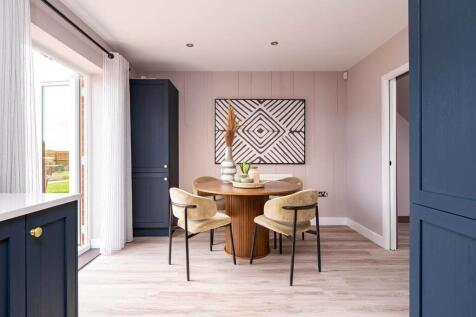 Double doors lead from the dining area to the garden, perfect for alfresco dining