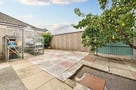 Wrap around Garden with Pear Tree and Green House