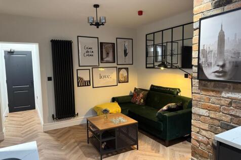 Stylish and cozy living room featuring modern d...