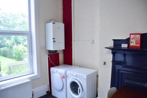 A functional kitchen area with a washing machin...