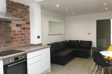 Modern open-plan living area with a fitted kitc...