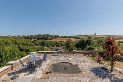 Paved terrace with inset fish pond