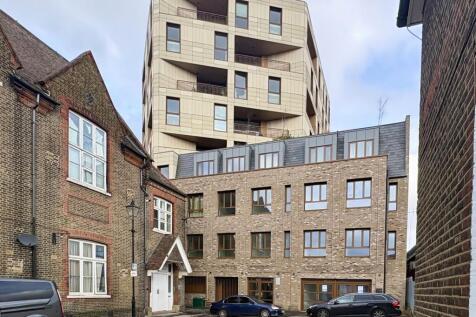 Street view of a modern mixed-use building risi...