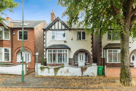A charming house with a well-maintained front g...
