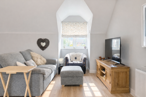 Cozy attic living room with natural light