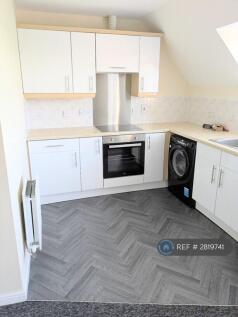 Kitchen With New Flooring And Cupboard Doors