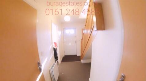 Bright entry hallway with neutral walls, fitted...