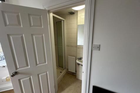 Compact bathroom with separate shower and clean...
