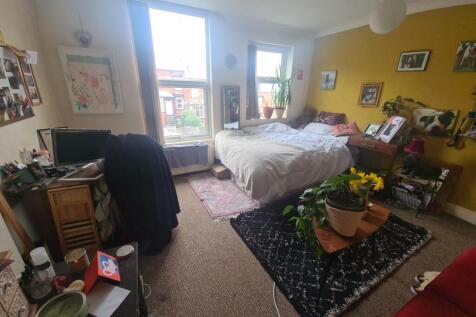 Bright and welcoming living room featuring larg...