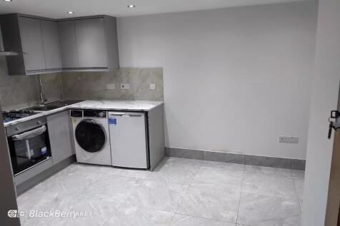 Modern fitted kitchen with stylish grey units...