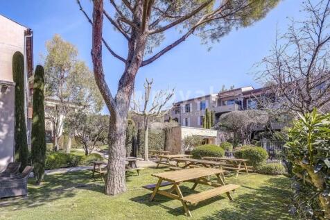 Exterior of residence with Mediterranean garden in