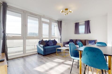 Bright living room with huge windows and sofa...