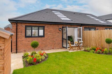 Typical Garden.  Every bungalow is fitted with solar panels.