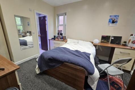 A spacious and well-maintained master bedroom f...