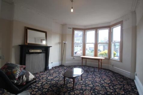 Spacious lounge with a bright bay window...