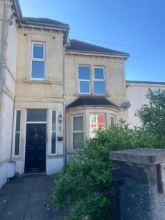 Elegant period facade with bright bay windows...