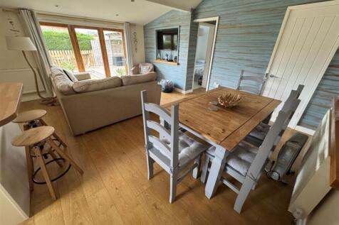 LIVING AREA, SITTING, DINING AND KITCHEN