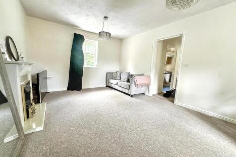 Bright and spacious lounge with comfy seating...