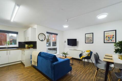 A bright and inviting large modern living room,...