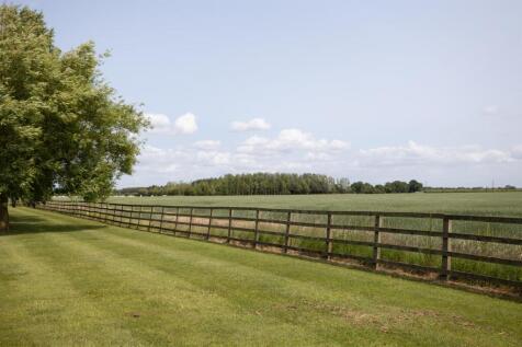 Paddock bordering open countryside